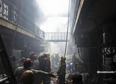 حریق گسترده در بازار بزرگ تهران ، 30 مغازه در آتش سوختند